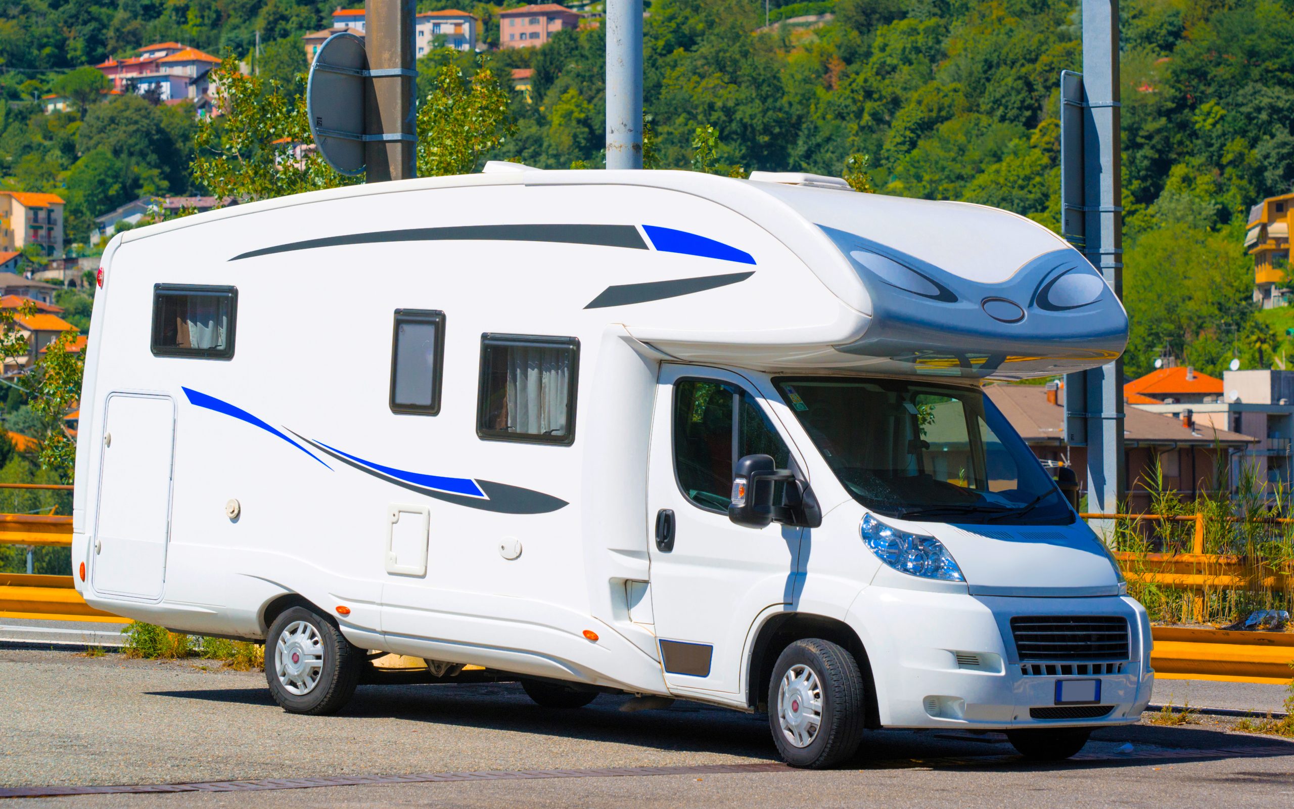 Vacation trip with Caravan Car on road in Switzerland. Camper and Summer drive on highway. Holiday journey in rv motorhome for recreation. Motor home minivan motion ride. Scenery with mini van vehicle